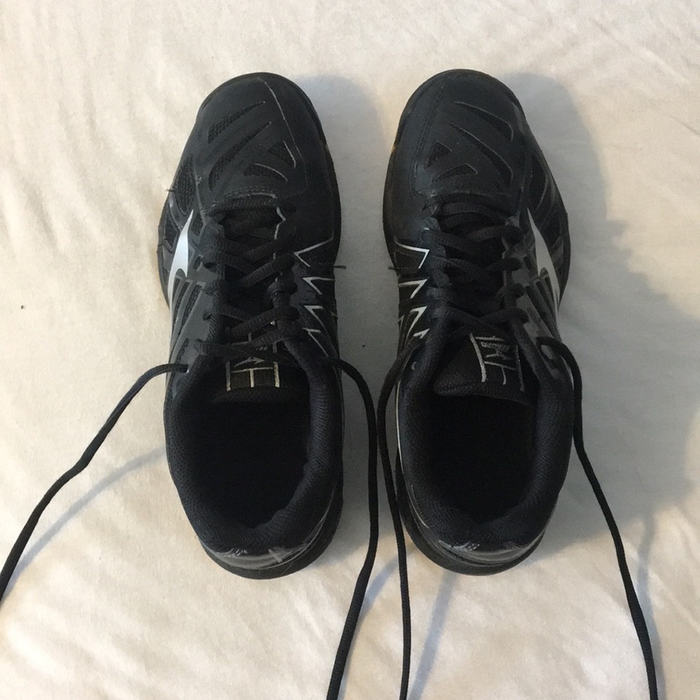 Black and silver Mizuno volleyball shoes